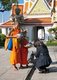 Thailand: Giving alms to novice monks at Wat Arun (Temple of Dawn), Bangkok