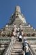 Thailand: Visitors climb the Khmer-style central prang at Wat Arun (Temple of Dawn), Bangkok